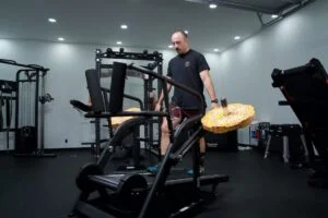 bells of steel dreadmill walking on dreadmill holding side up plates on side