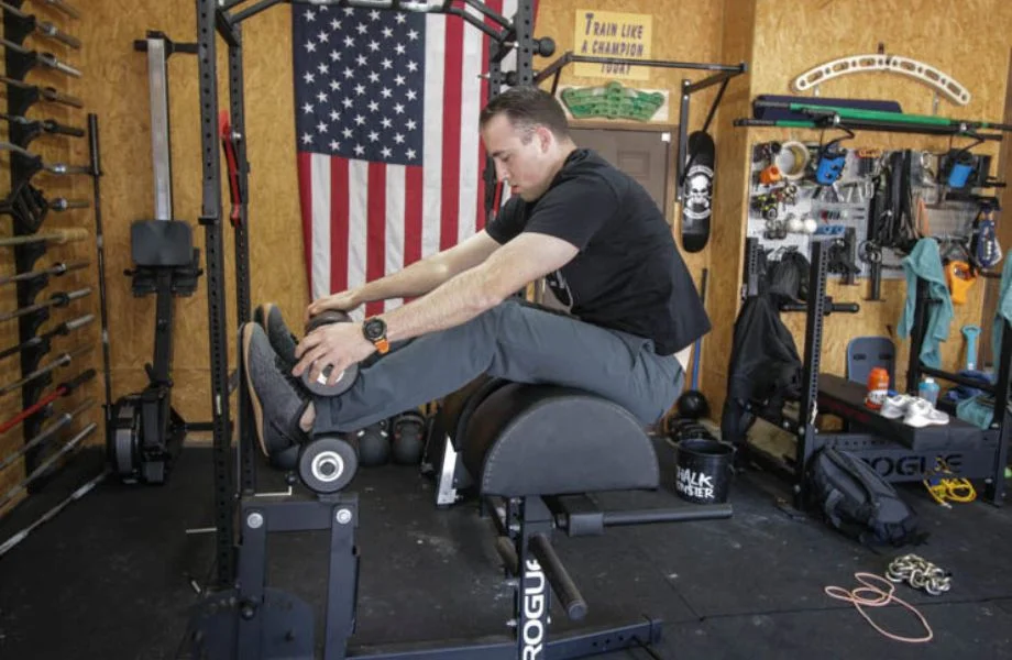 A man doing sit-ups on the Rogue Abram 2.0