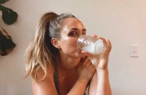 woman drinking klean creatine