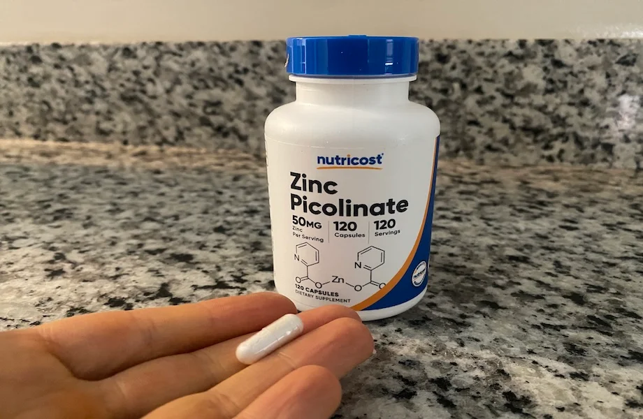 Our tester holding a capsule of Nutricost Zinc Picolinate