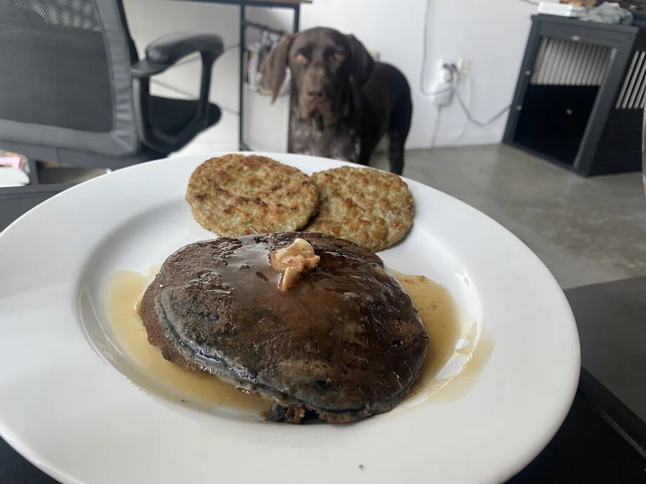 A plated meal of blueberry pancakes from Factor