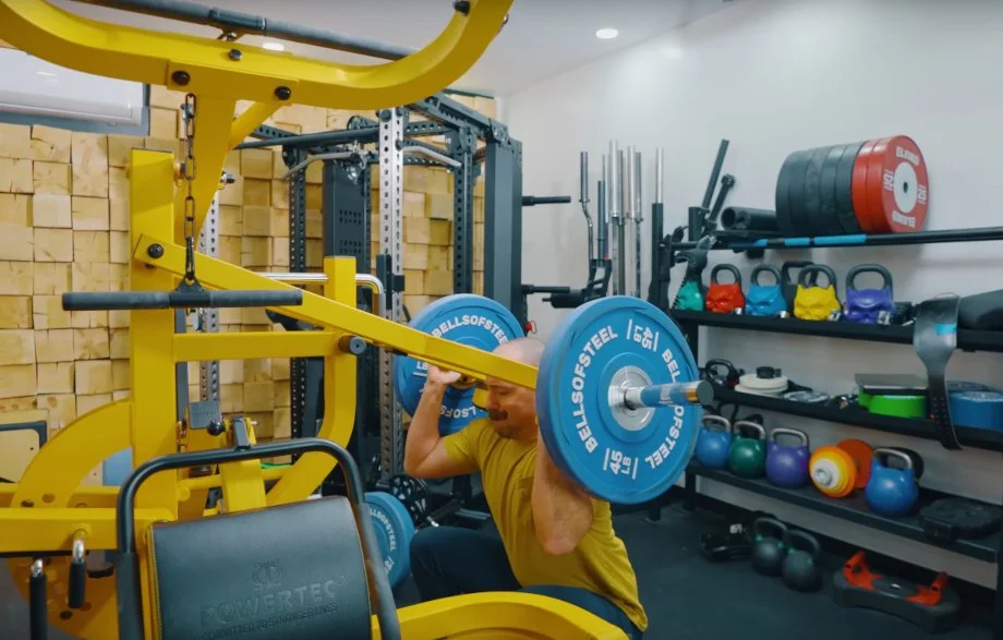 Coop does a squat press on the Powertec Workbench Multistation