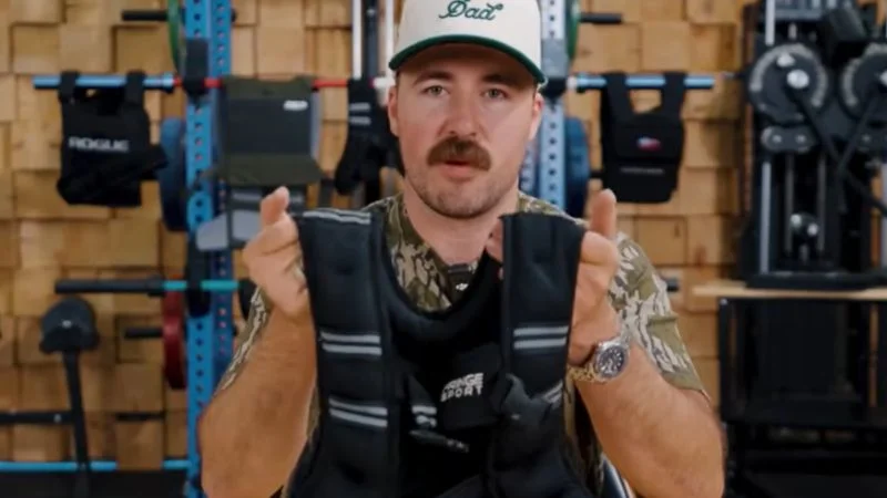 coop-holding-fringe-sport-wodmaster-weight-vest A man holding the Fringe Sport WODmaster weight vest