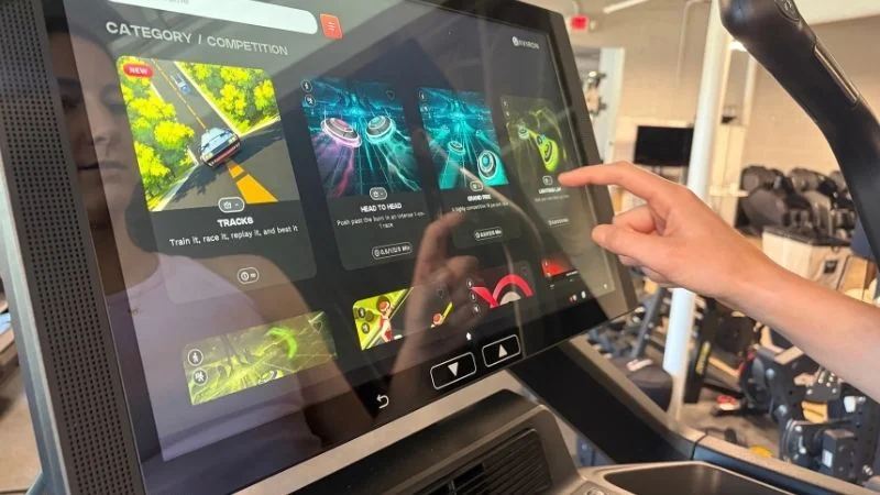 Our tester using the display screen on the Aviron Summit Treadmill.