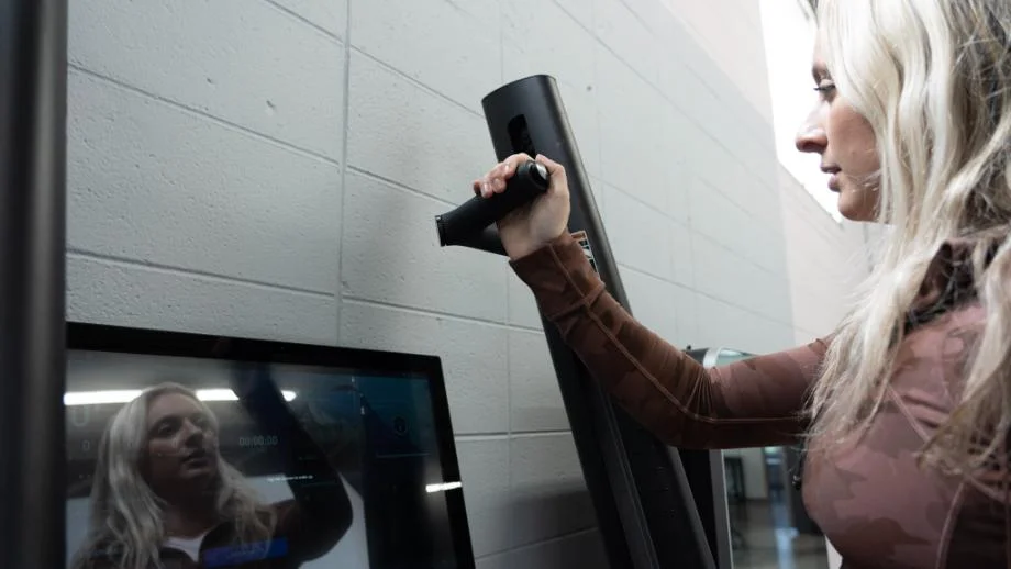 Woman testing out the CLMBR