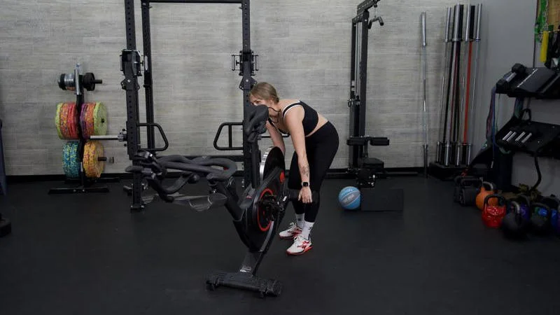 Our tester moving the Echelon EX-5 exercise bike