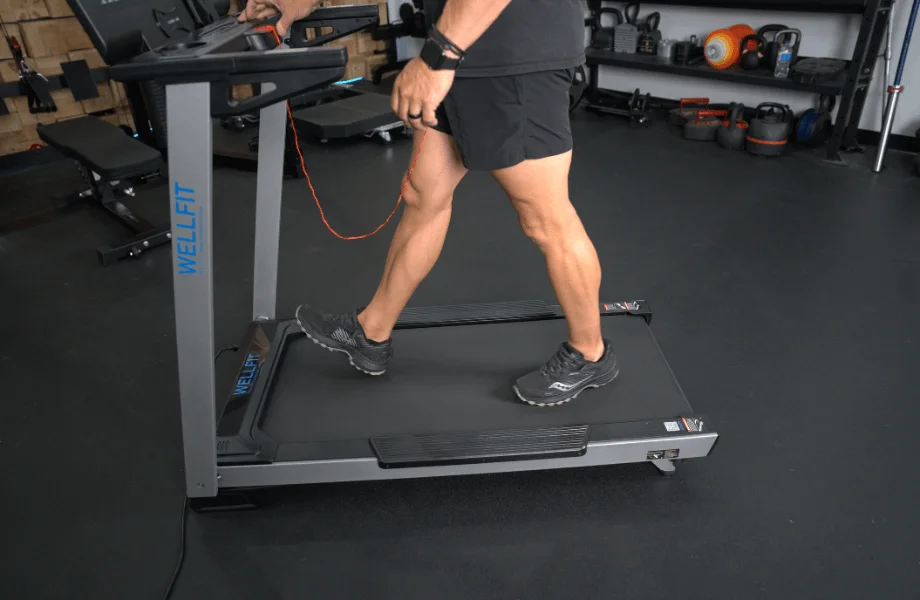 Our tester walking on the Wellfit TM024 Treadmill