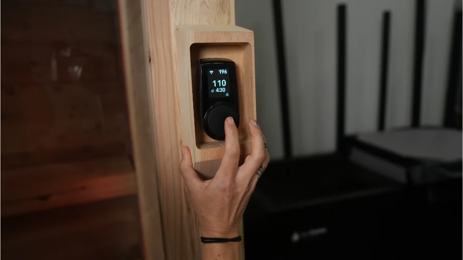 Adjusting the temp controls on the Plunge Sauna.