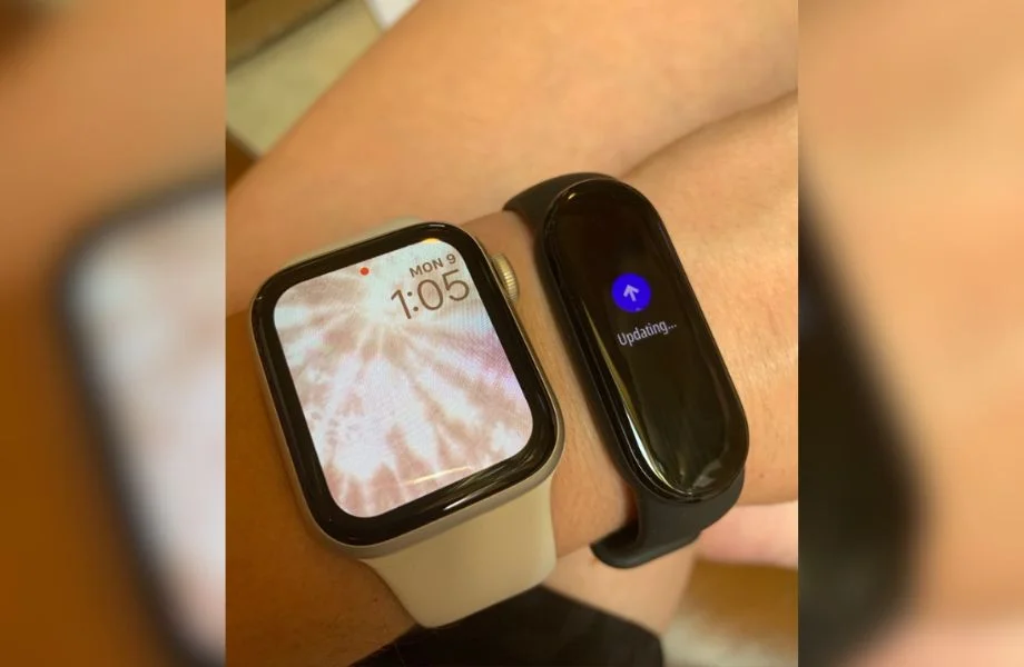 Person wearing both Xiaomi Mi Smart Band 6 and Apple Watch