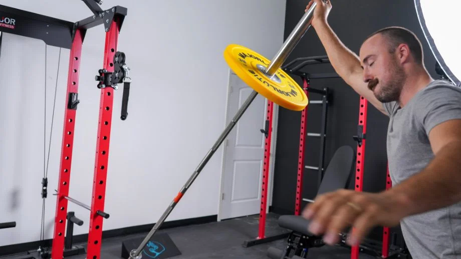 Man using the landmine attachment of the Major Lutie Power Rack