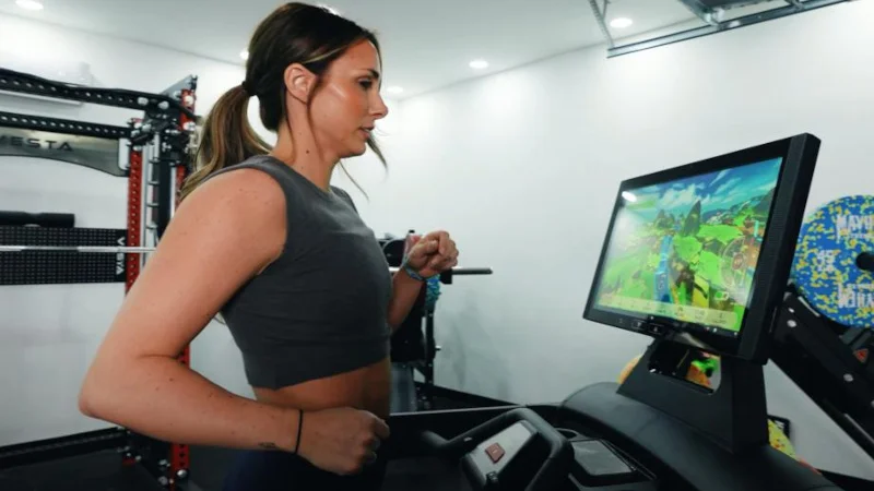 A woman runs on a treadmill