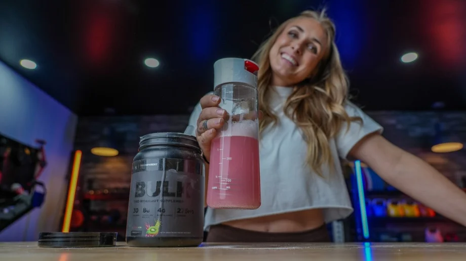 An image of a person holding Transparent Labs Bulk Black pre-workout in a shaker