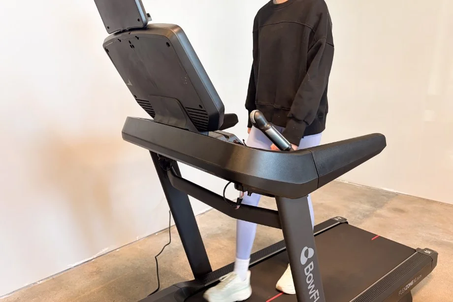 A GGR product tester walking on the Bowflex T16 treadmill