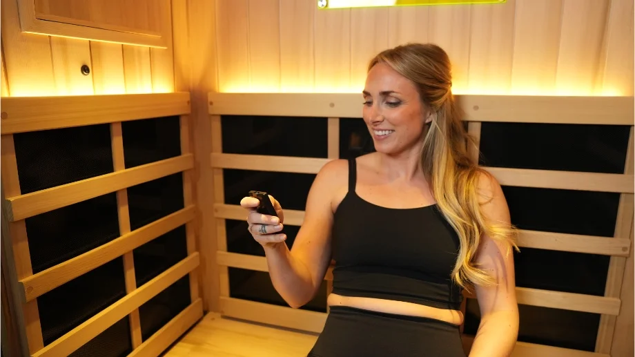 higher dose full spectrum infrared sauna close up using remote