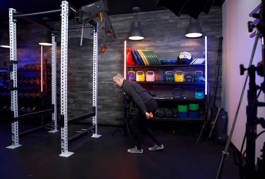 Man using Torque Relentless Ripper ski machine with a split stance