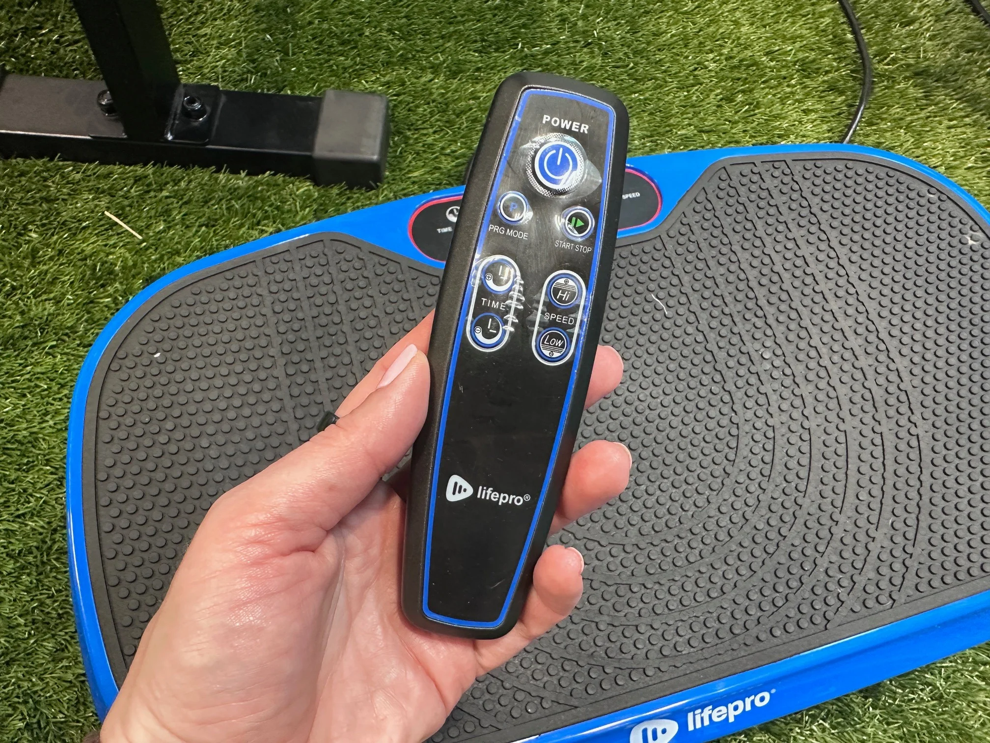 A close look at the remote for the LifePro Waver Mini vibration plate.