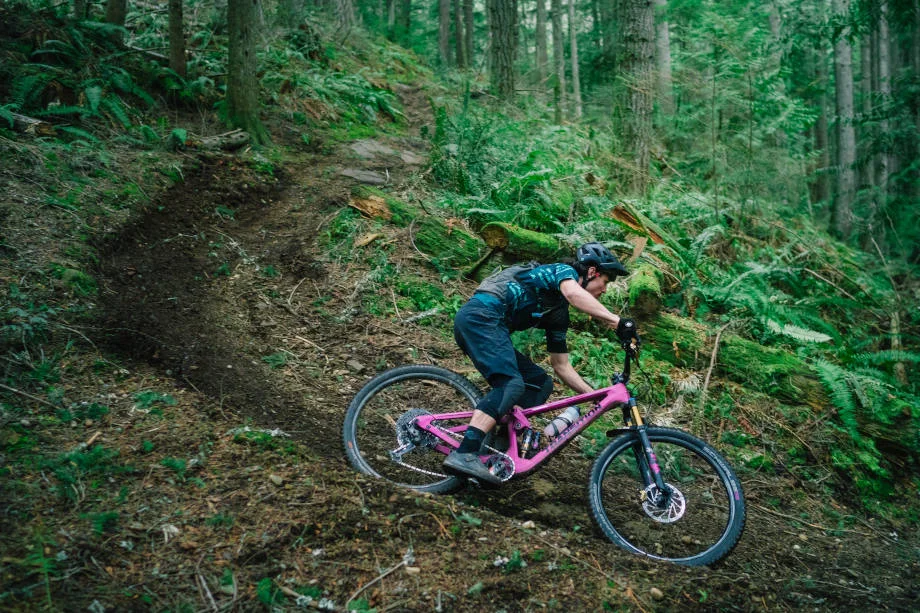 Luke Burgess downhills on a windy path with a Transition Smuggler