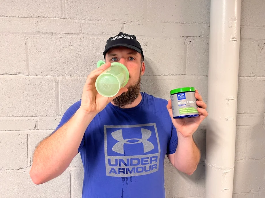 An image of a person drinking Power Life Peak Replenish electrolytes