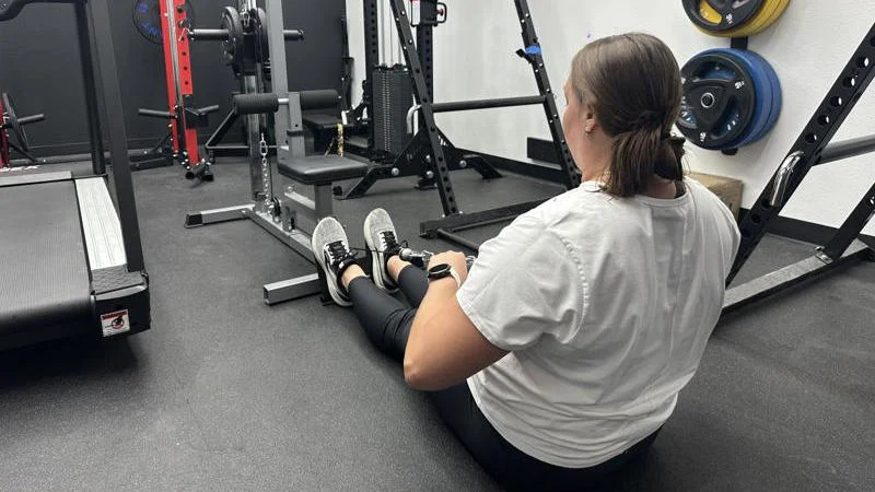 Our tester doing low rows with the GDLF Lat Pulldown Machine