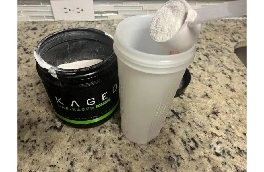 kaged stim free pre workout being testing in a shaker bottle