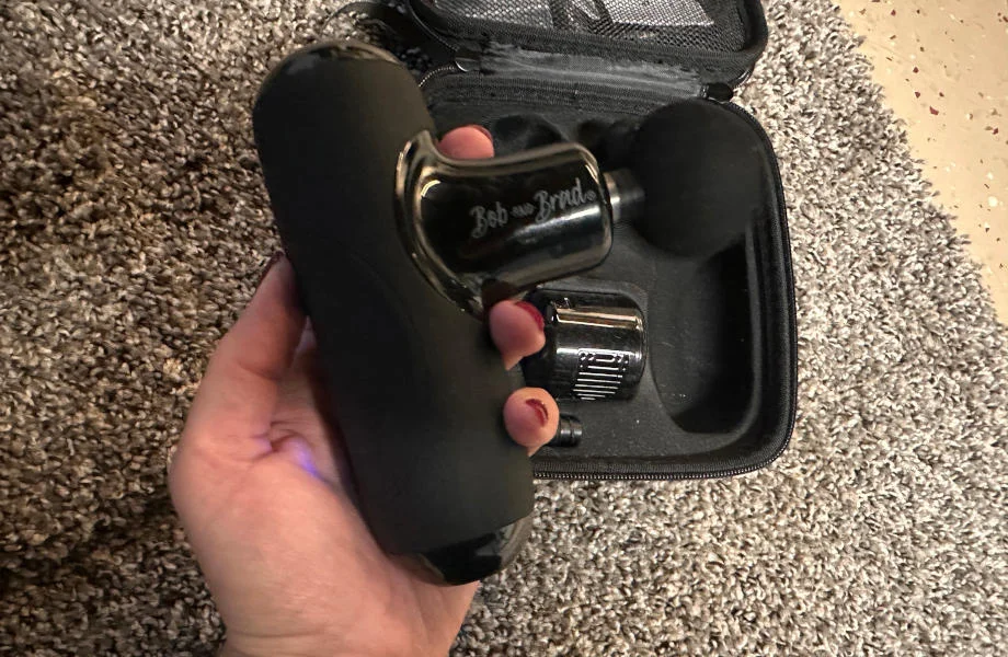 A person holds the Bob & Brad Q2 Mini Pro in their hand