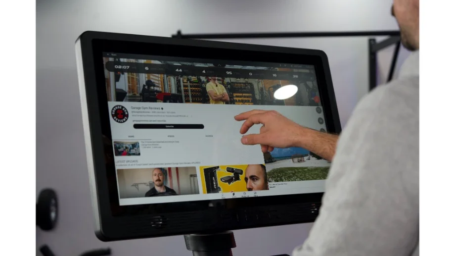 Choosing a YouTube video on the STEPR display screen.