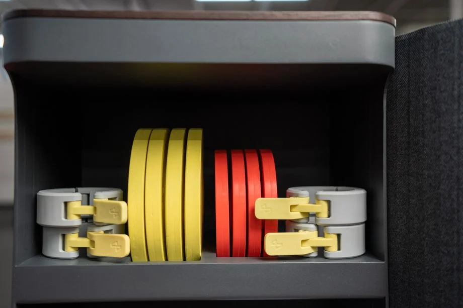 Tempo Move weights and collars inside storage cabinet