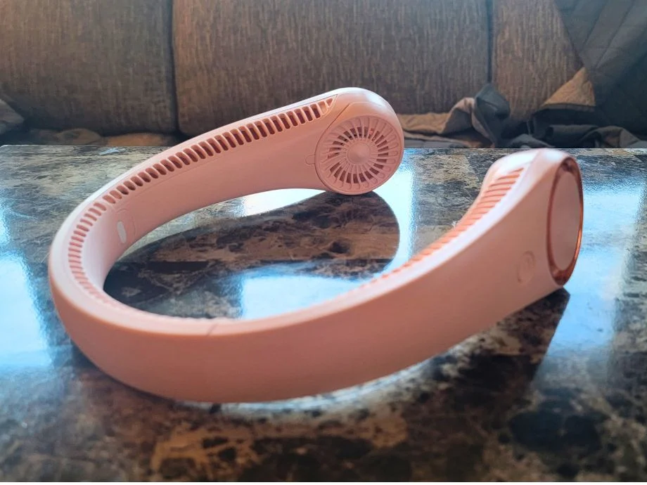 A CIVPOWER Neck Fan rests on a countertop
