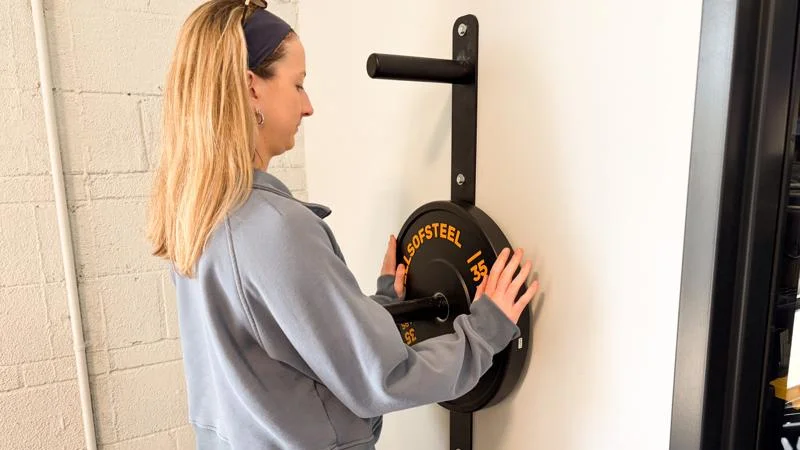 Our tester loading the PRx Wall Mounted Plate Storage tree.