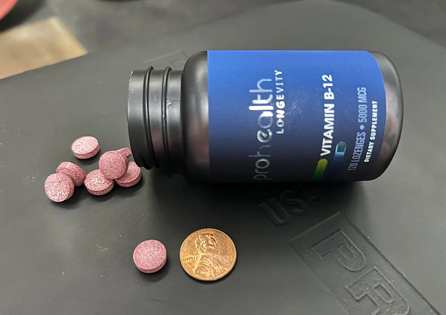 bottle-of-prohealth-b-12-with-lozenges-next-to-penny
