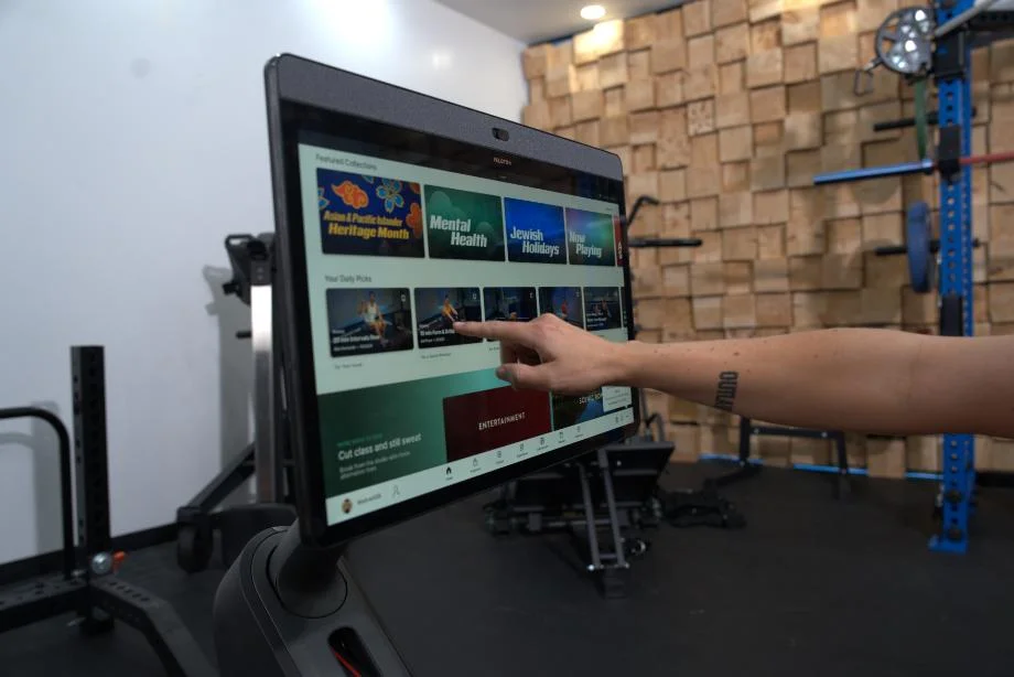The Peloton Rower's HD touchscreen being used