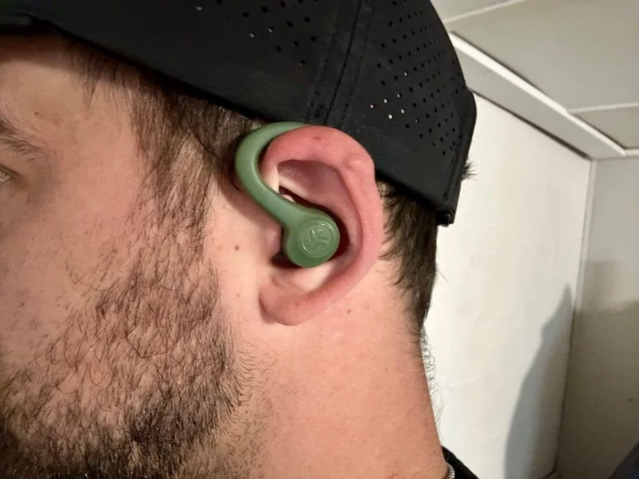 Our tester wearing JLab Go AIr Sport wireless earbuds.