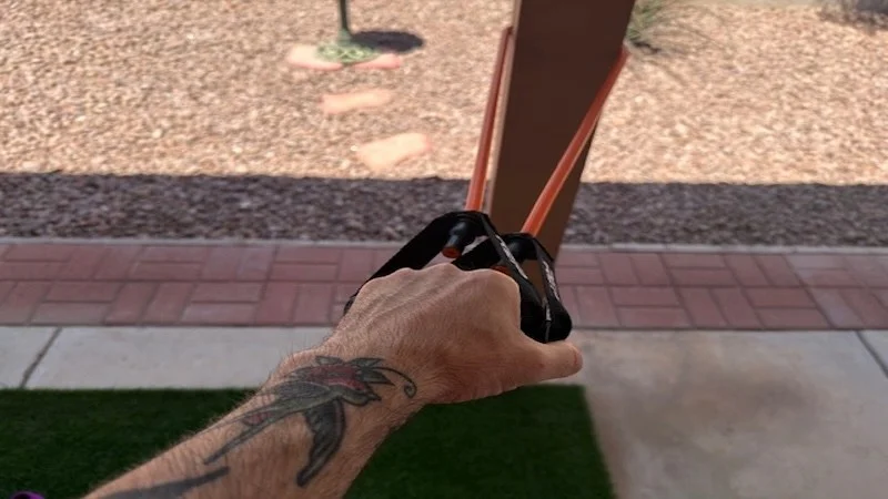 A person using a REP Fitness Tube Resistance Band