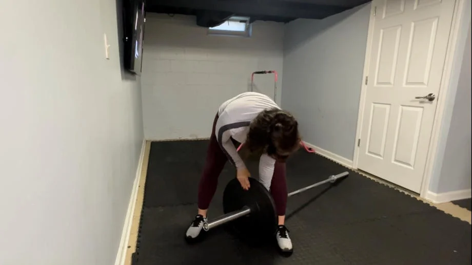 Installing weights on the Bells of Steel Olympic Weightlifting Bar 2.0