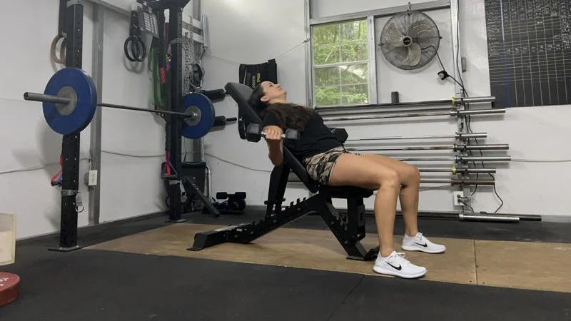 Our tester working out on the Force USA Pro Series FID Bench