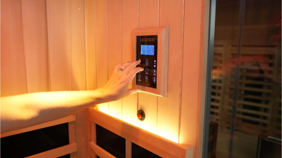 higher dose full spectrum infrared sauna close up adjusting controls on inside panel
