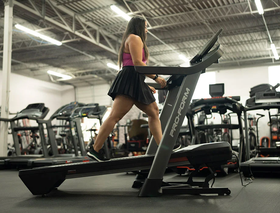 woman walking on high inlcine treadmill