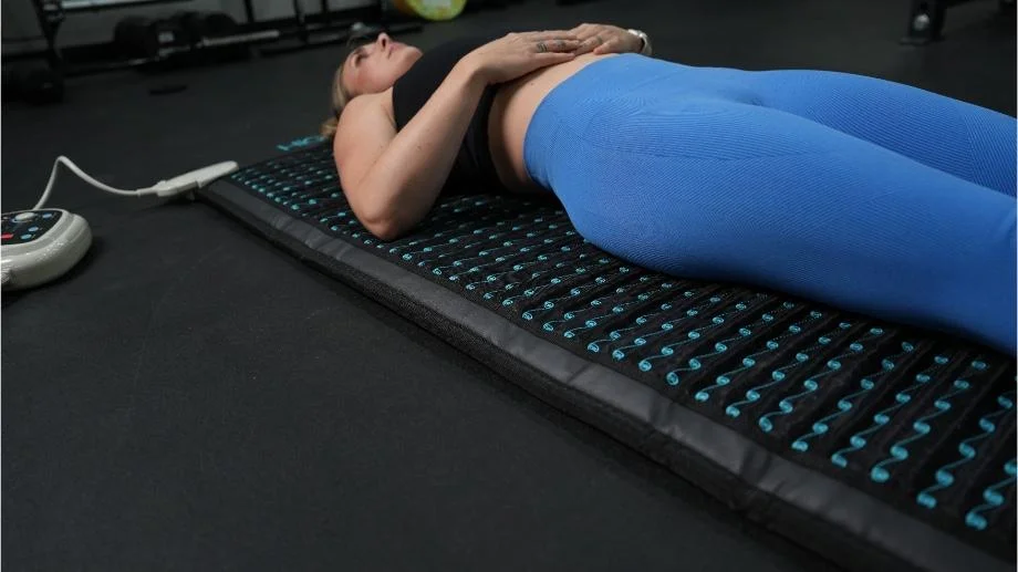 Higher Dose PEMF Mat close up side of mat model laying down
