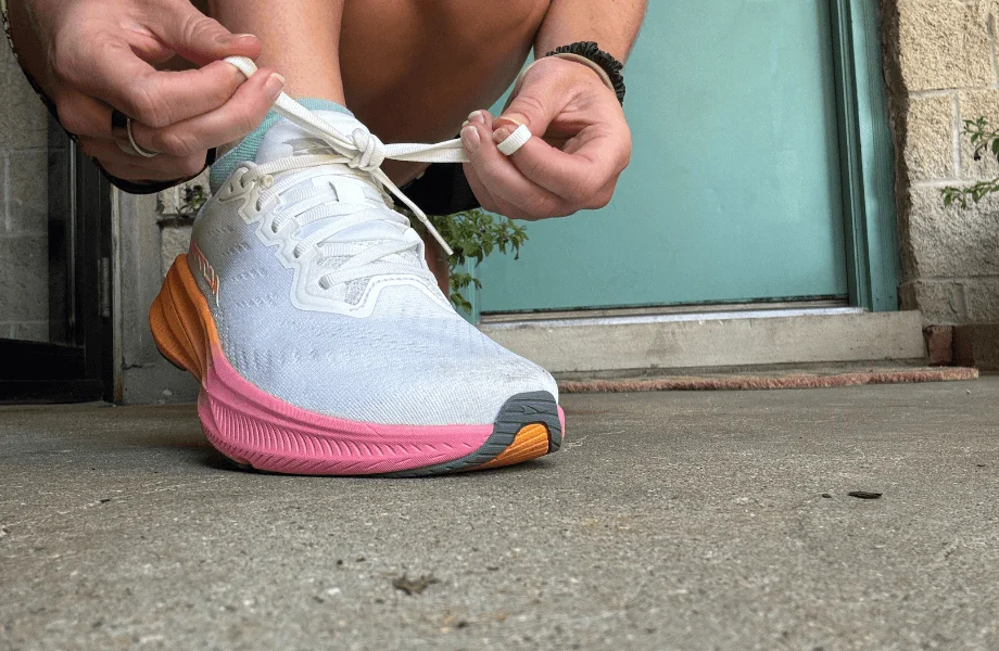 Our tester lacing up a pair of Altra Experience Flow 2 running shoes before a training session