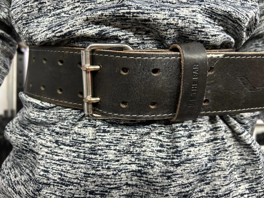 A close-up of a person wearing the Eleiko Premium Weightlifting Belt