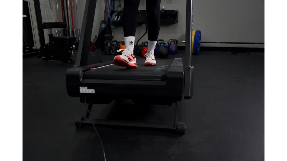 Close up shot of person walking at an incline on Echelon Stride 8s