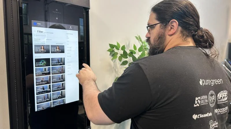Our tester selecting a workout on the Tonal 2