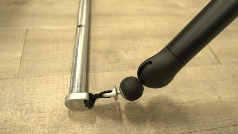 A close look at the connection between the handle and cable on a Tonal 2 Smart Home Gym.