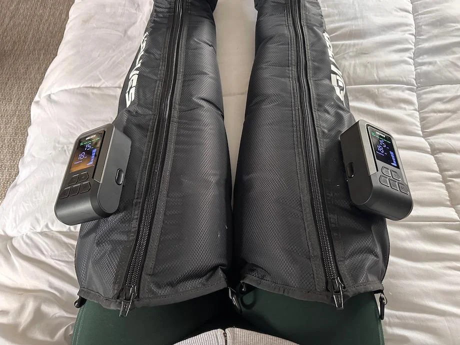 Looking down at legs wearing Ublives Compression Boots.