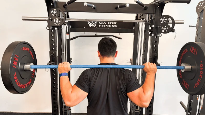 Our tester unracking a barbell from the Major Fitness B52 Pro