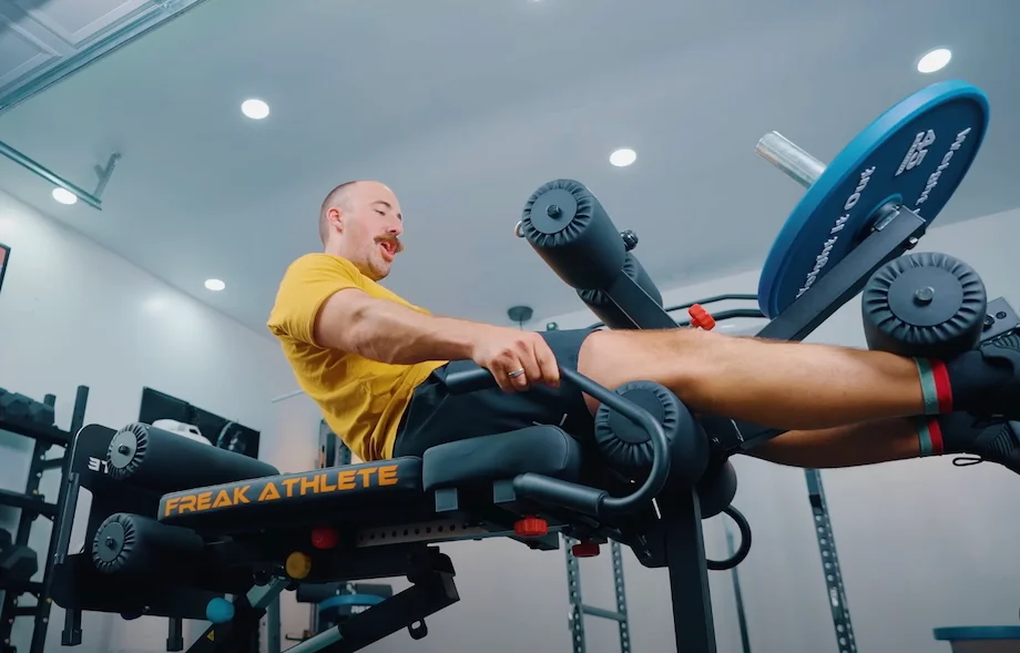Coop performs leg extensions on the Freak Athlete Hyper Pro