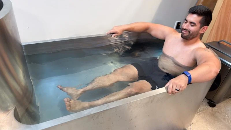 Our product tester soaking in the tub of a Polar Monkeys Contrast Edition Plunge.