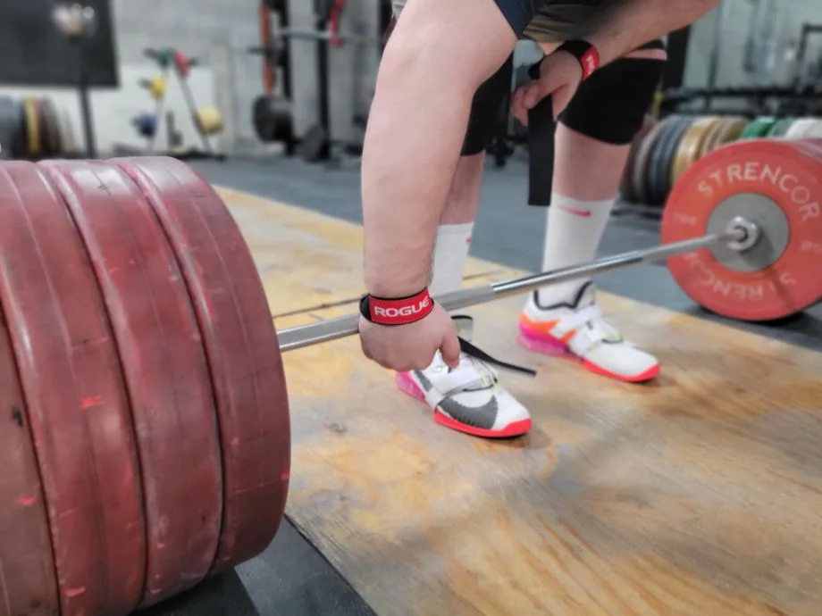 Man preparing to deadlift with the Rogue Ohio Straps