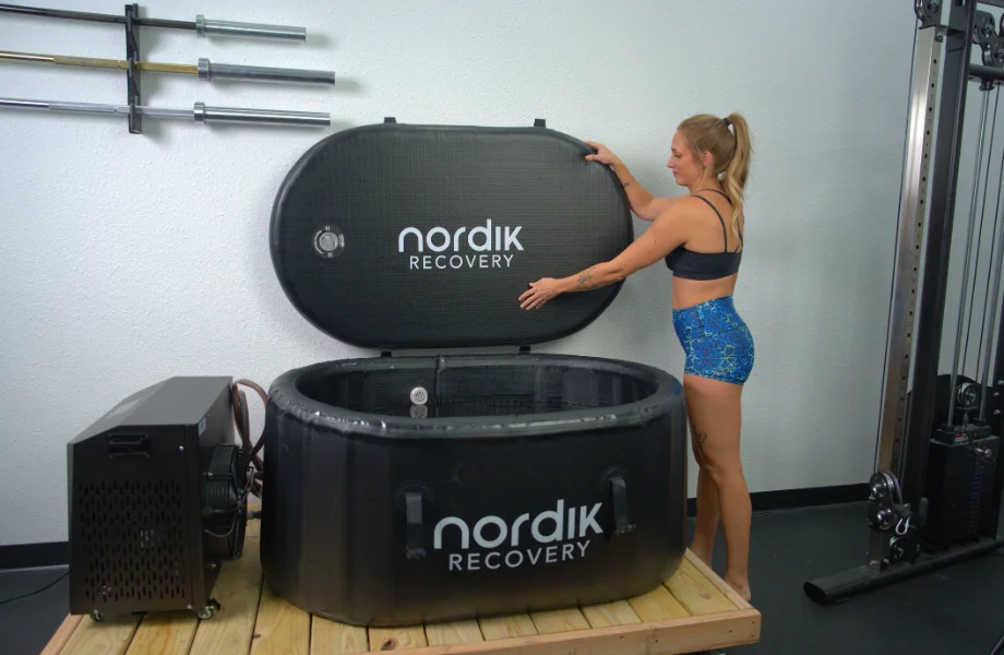 Our tester closing the lid to the Nordik Recovery Cold Tub