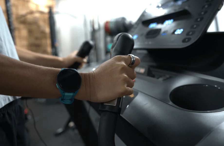 Our tester grabbing hold of the QuickDial handles featured on the Bowflex T6 treadmill